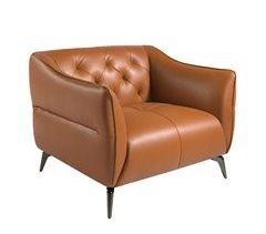 Sillón tapizado en piel con capitoné